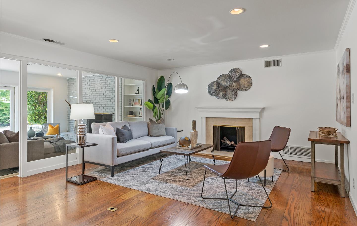 1340 Hillview Drive Menlo Park, CA 94025 - Photo 7 of 29 a living room with furniture a fireplace and wooden floor