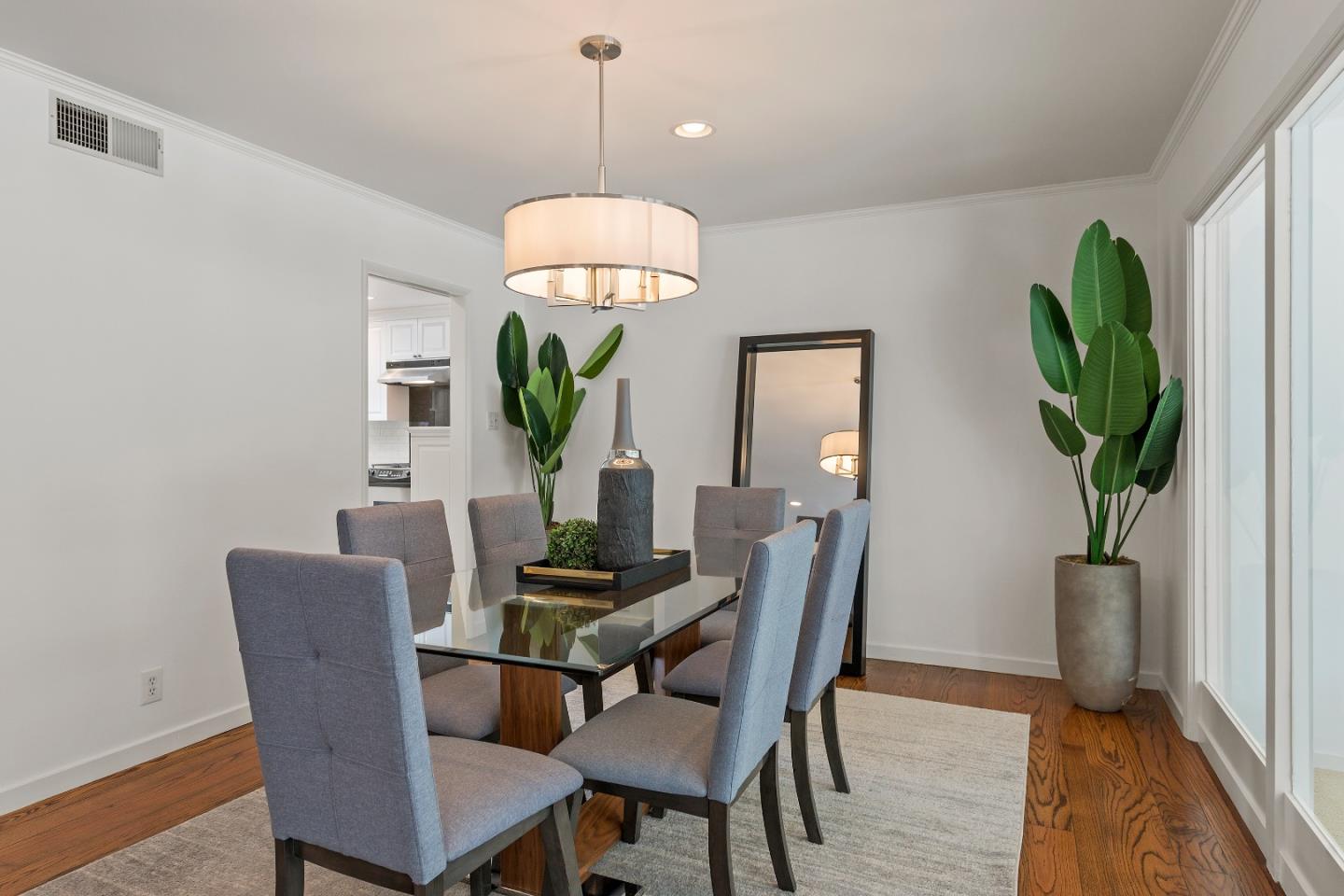1340 Hillview Drive Menlo Park, CA 94025 - Photo 9 of 29 a dining room with furniture a chandelier and wooden floor