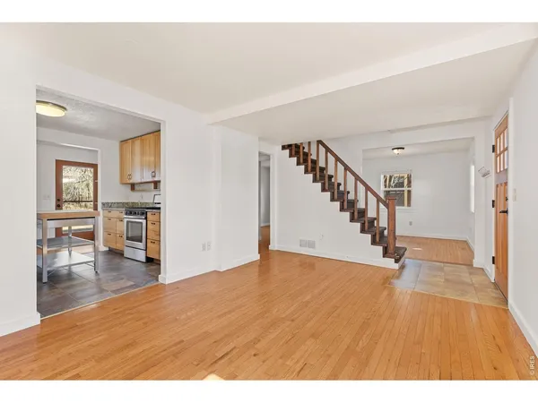 a view interior of a house wooden floor and an entryway