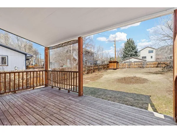 a view of balcony with wooden floor