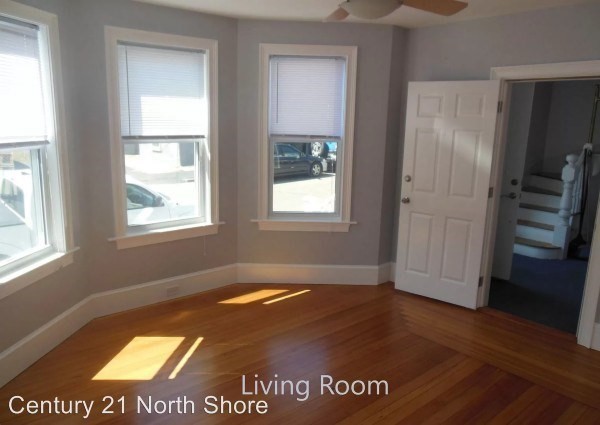 5 Pearl Street, Unit 1 Salem, MA 01970 - Photo 4 of 14 a view of an empty room with wooden floor and a window