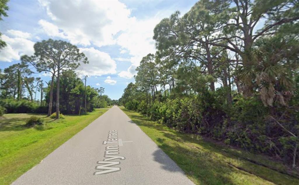 5249 Wynn Terrace Port Charlotte, FL 33981 - Photo 9 of 13 a view of a pathway with a yard