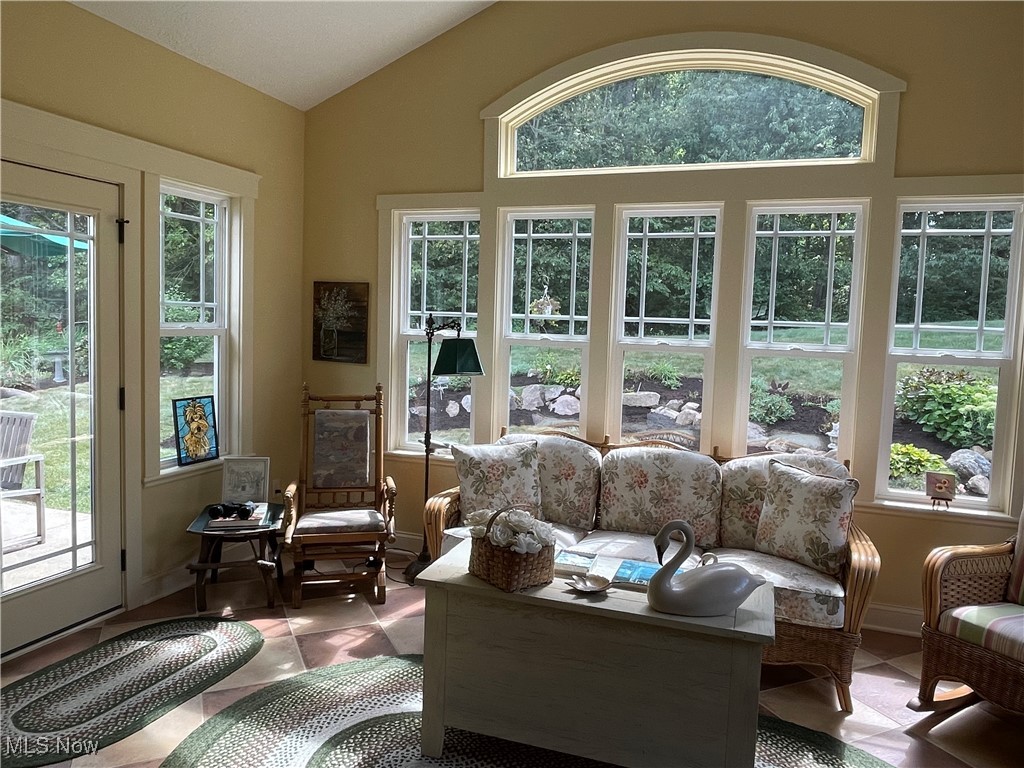 8322 Forest Ridge Street Northwest Massillon, OH 44646 - Photo 19 of 33 Sunroom / solarium featuring vaulted ceiling and plenty of natural light
