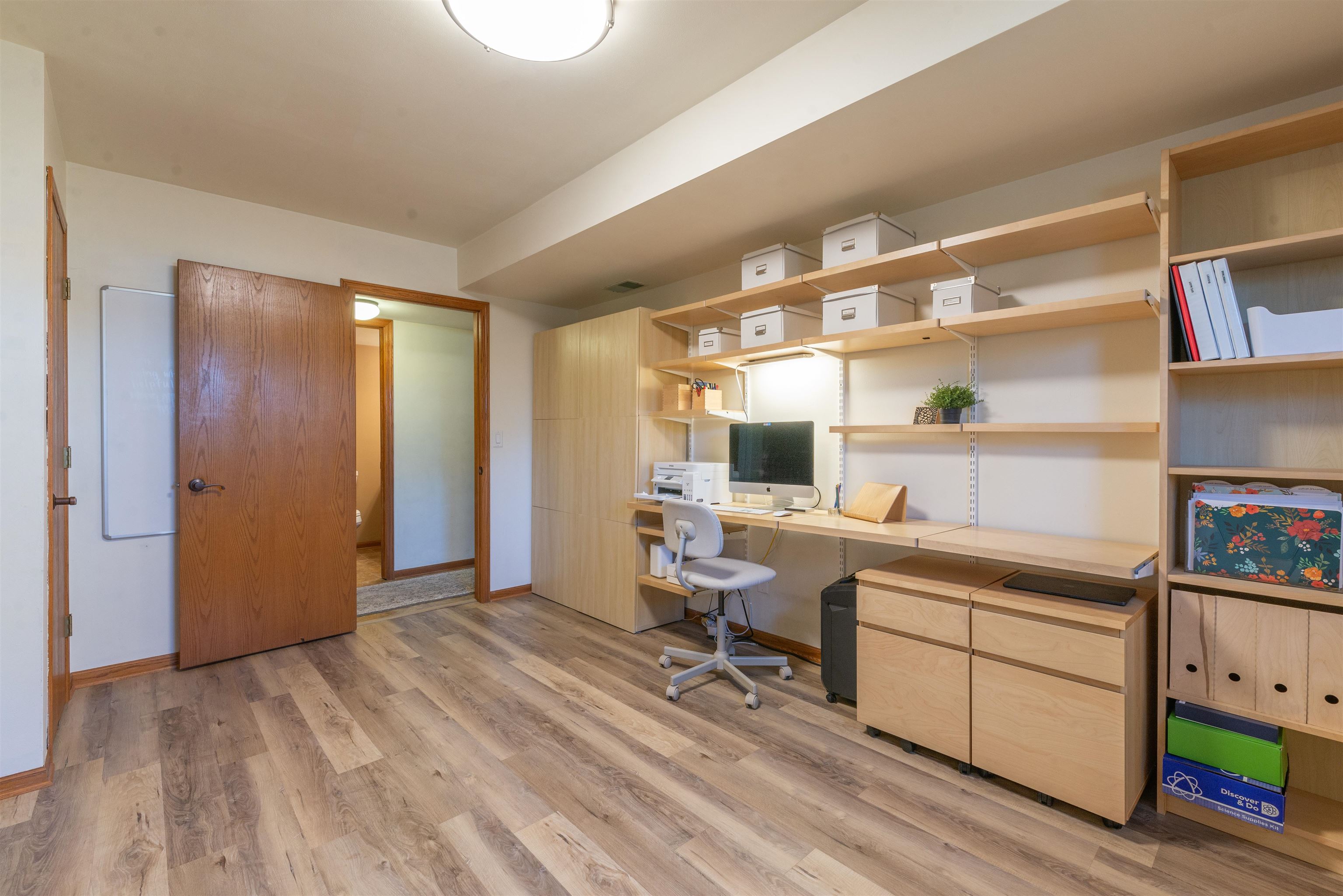2210 Country Court Freeport, IL 61032 - Photo 21 of 41 a room with a wooden floor and furniture