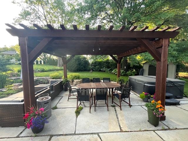 2210 Country Court Freeport, IL 61032 - Photo 32 of 41 a view of a patio with a table chairs and a yard