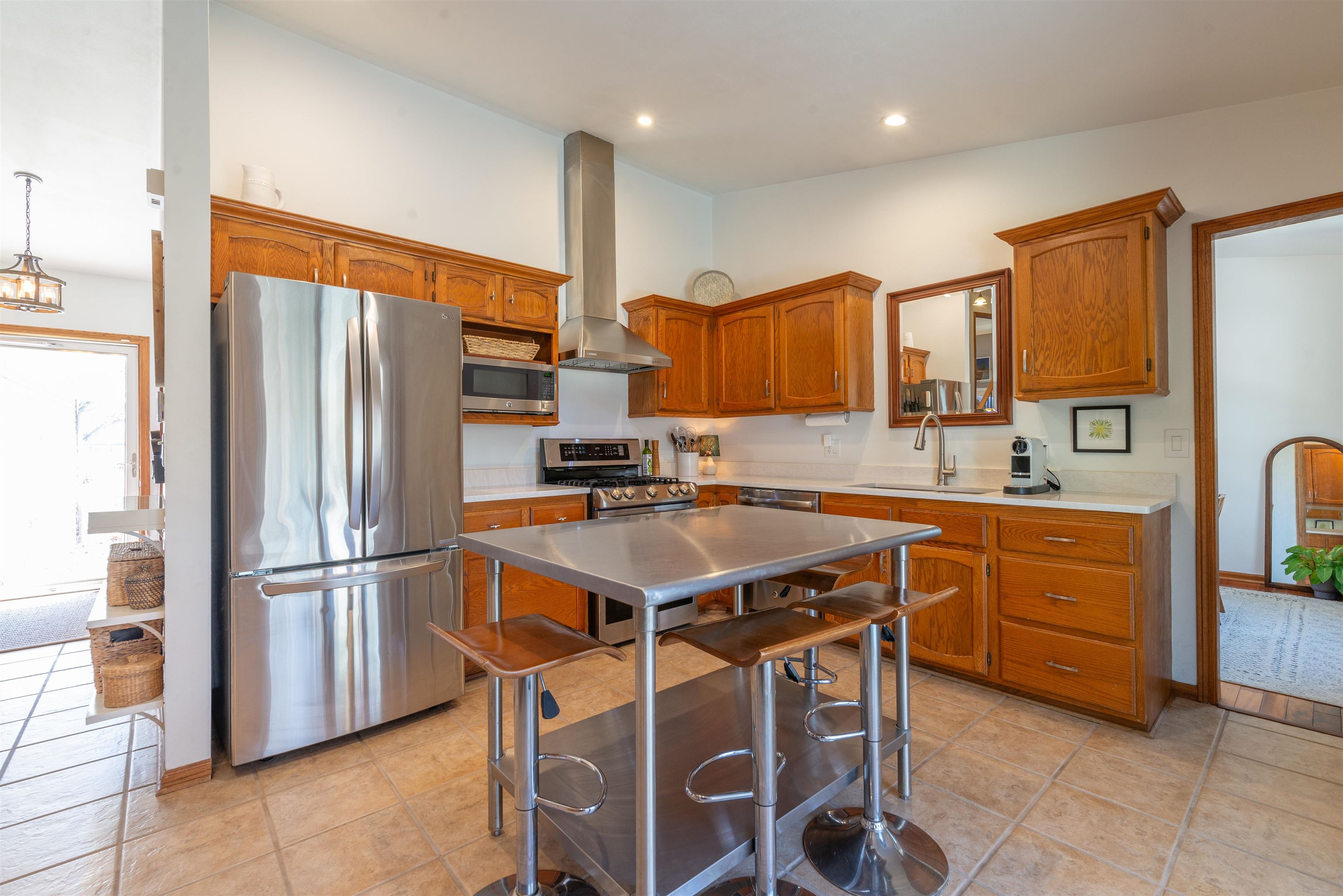 2210 Country Court Freeport, IL 61032 - Photo 9 of 41 a kitchen with stainless steel appliances granite countertop a refrigerator a stove a sink a dining table and chairs