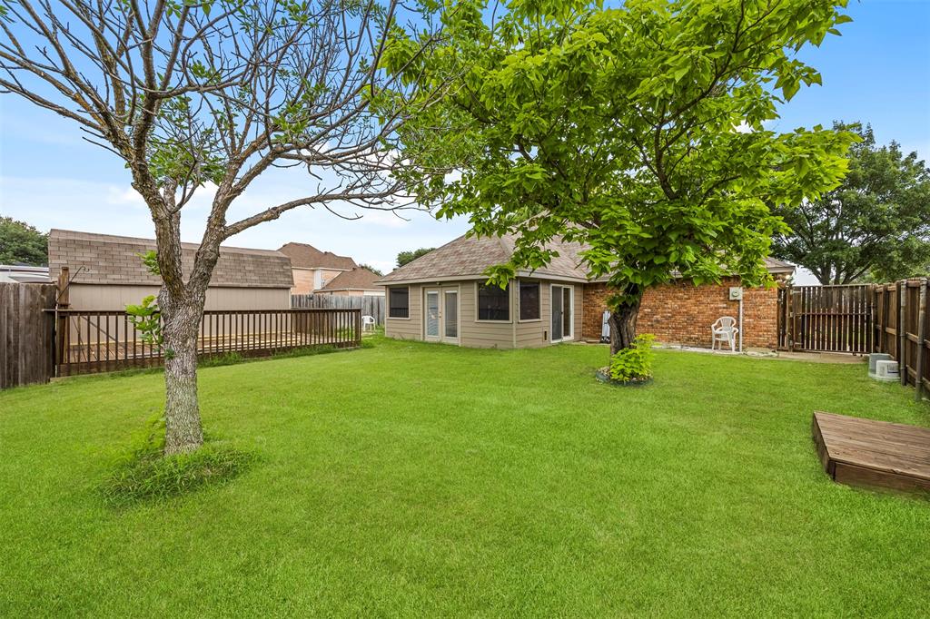 909 Valley View Avenue Red Oak, TX 75154 - Photo 30 of 37 a view of a house with a yard