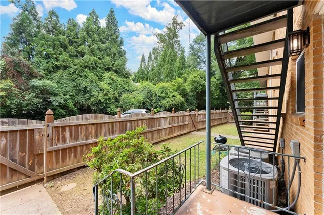 a view of balcony with wooden floor