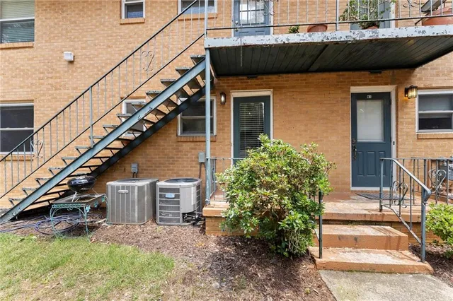 a view of a house with a small yard