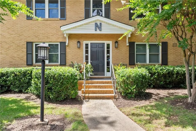 a front view of a house having yard