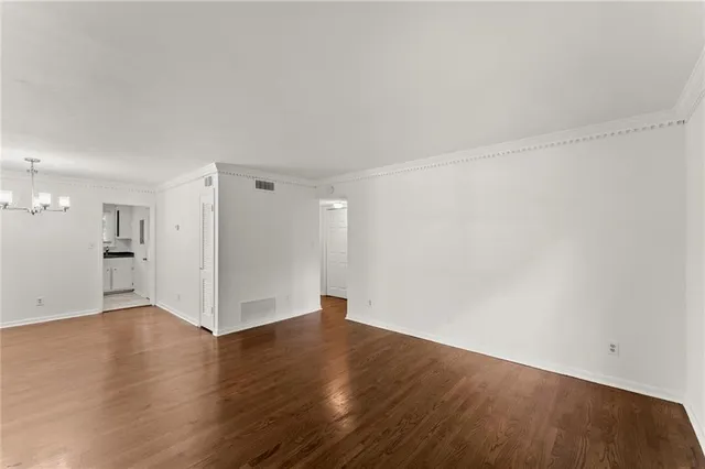 an empty room with wooden floor