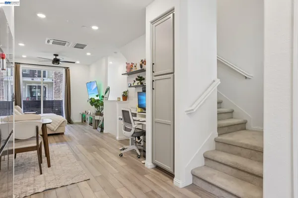 a bedroom with furniture and a lamp