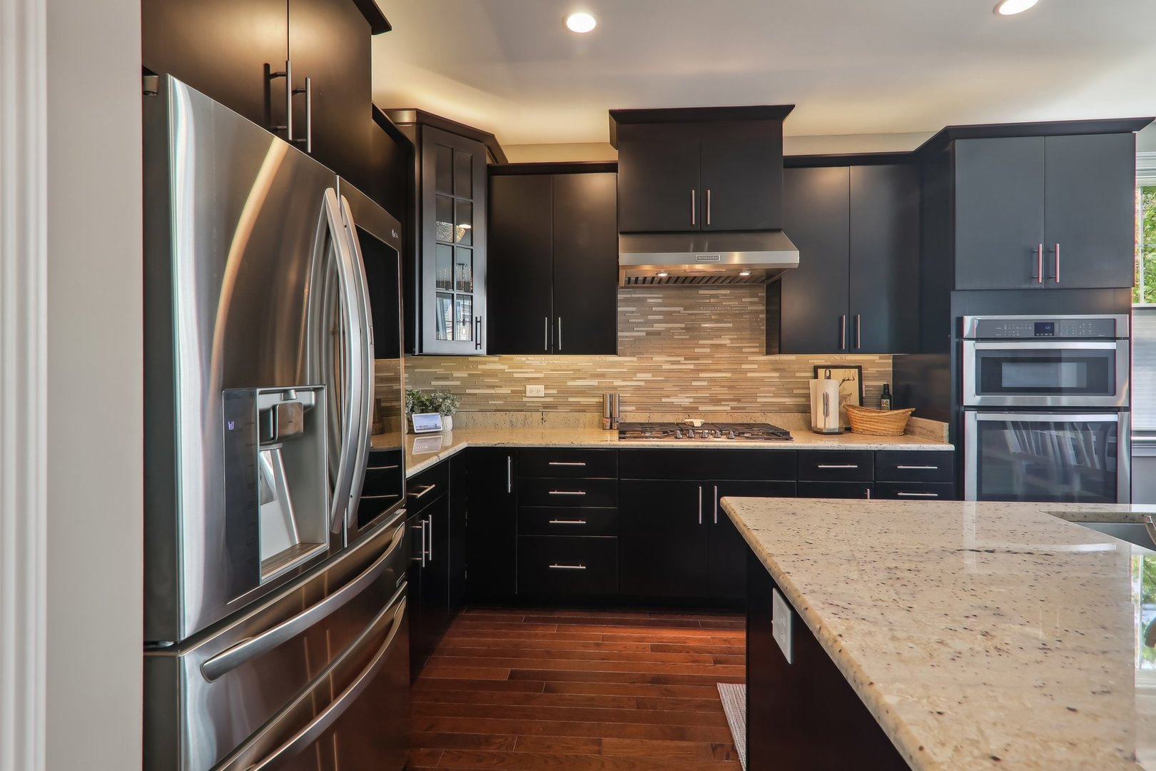 1228 Falcon Ridge Drive Elgin, IL 60124 - Photo 8 of 36 a kitchen with stainless steel appliances granite countertop a refrigerator a stove and a sink