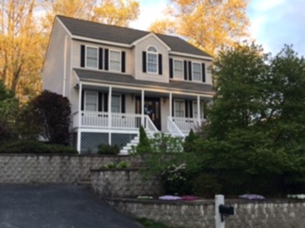 197 Acropolis Road Lowell, MA 01854 - Photo 1 of 29 a front view of a house with a yard