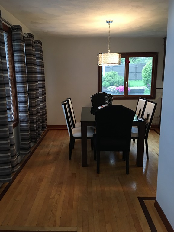197 Acropolis Road Lowell, MA 01854 - Photo 15 of 29 a view of a dining room with furniture