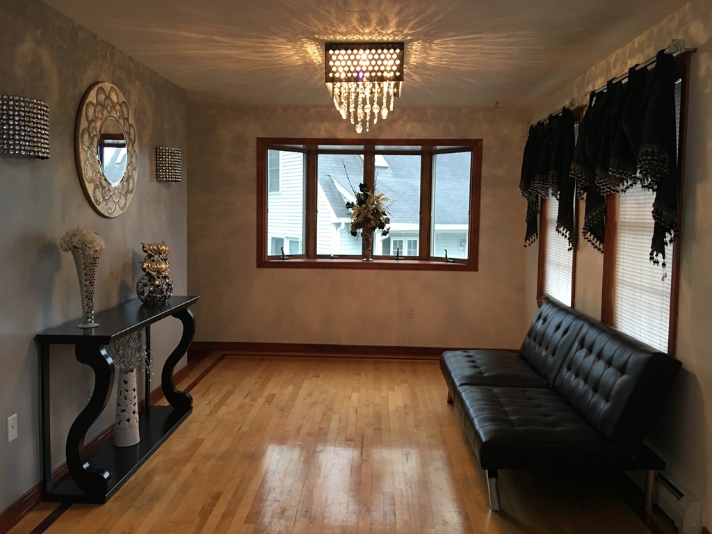 197 Acropolis Road Lowell, MA 01854 - Photo 16 of 29 a view of an entryway with wooden floor and a window