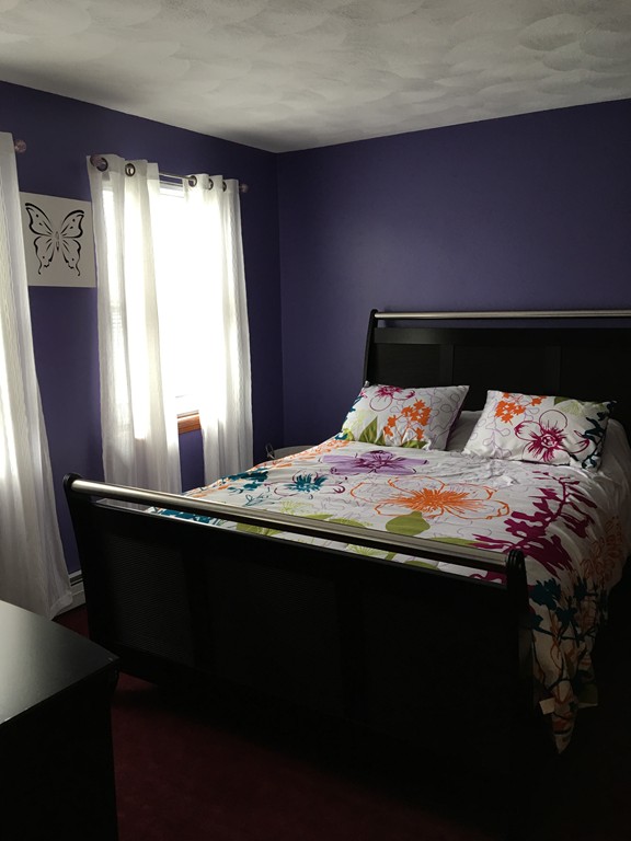 197 Acropolis Road Lowell, MA 01854 - Photo 25 of 29 a bedroom with a bed and window