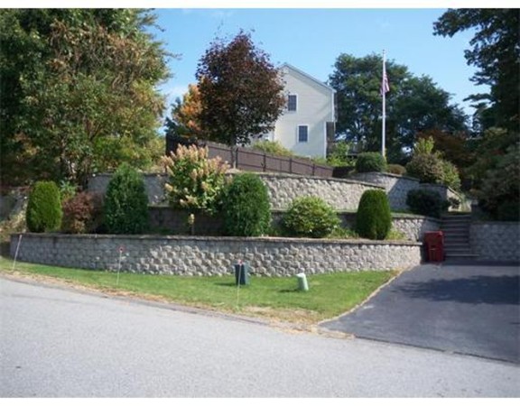 197 Acropolis Road Lowell, MA 01854 - Photo 3 of 29 a view of a yard with a house in the background