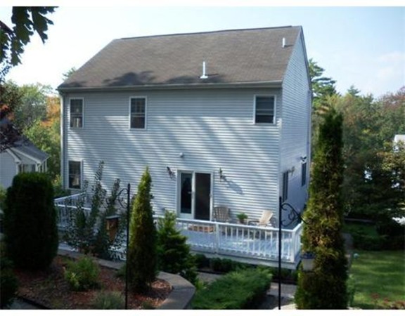 197 Acropolis Road Lowell, MA 01854 - Photo 6 of 29 a front view of a house with a garden