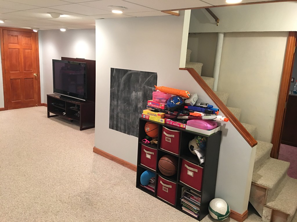 197 Acropolis Road Lowell, MA 01854 - Photo 7 of 29 a room with furniture and a flat screen tv