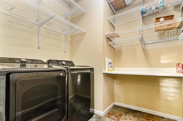 a utility room with washer and dryer