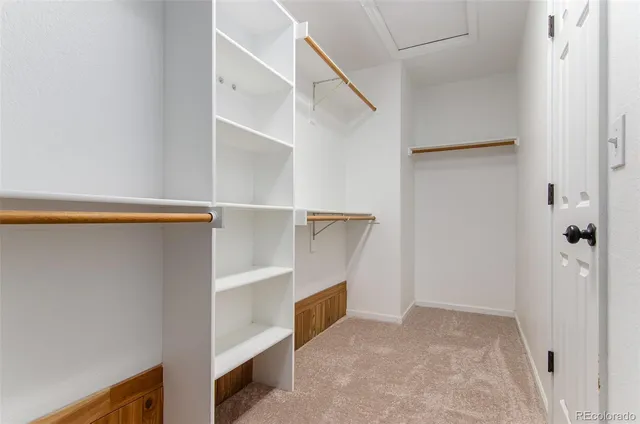 an empty room with a empty space and a ceiling fan