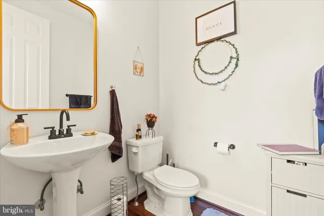 a bedroom with furniture and a flat screen tv