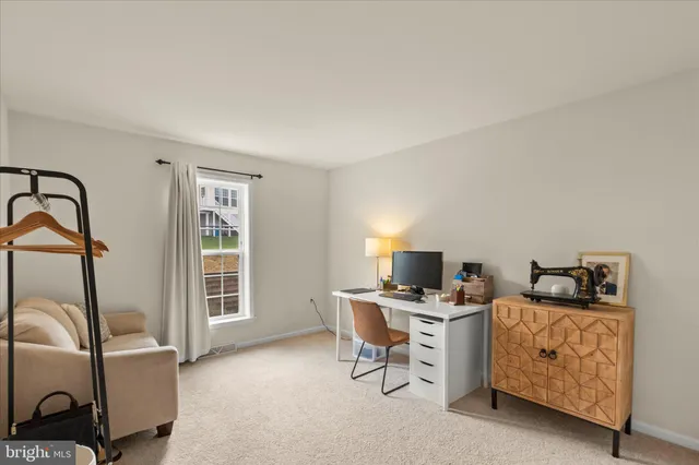 a bedroom with furniture and a closet