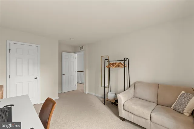a bathroom with a double vanity sink and mirror with bathtub