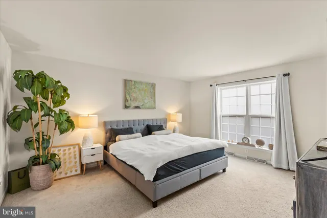 a bathroom with a tub sink and glass door shower
