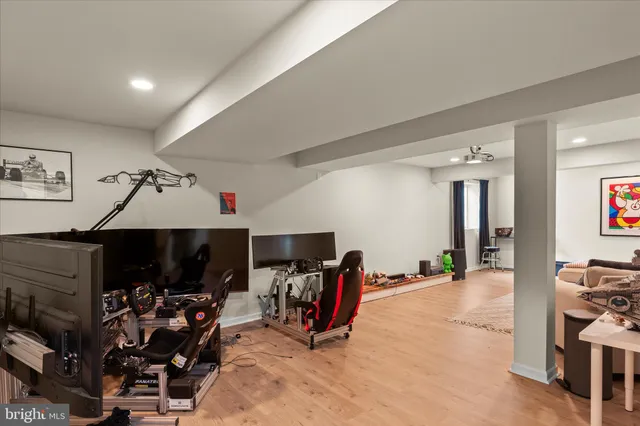a utility room with dryer washer and stair