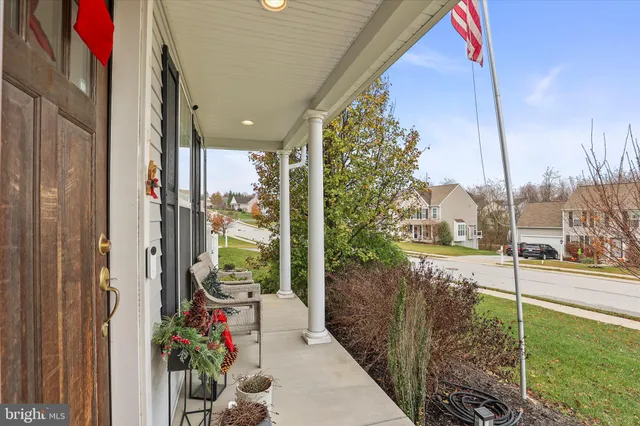 a living room with furniture potted plant and a window
