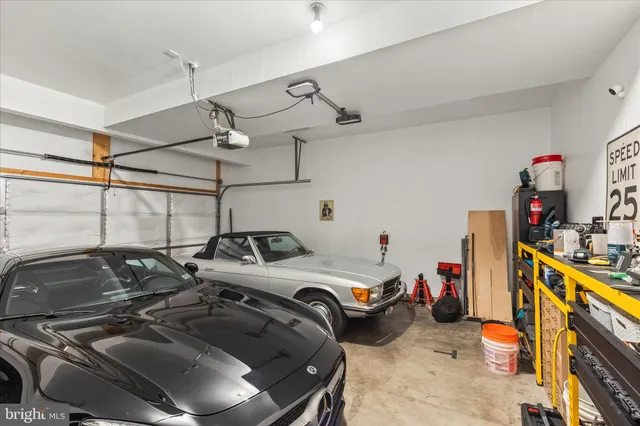 a view of a patio with chairs and a potted plant