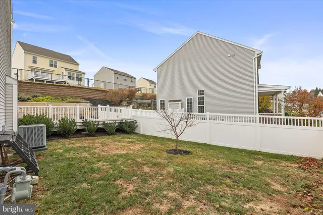 a view of a patio with a table and chairs