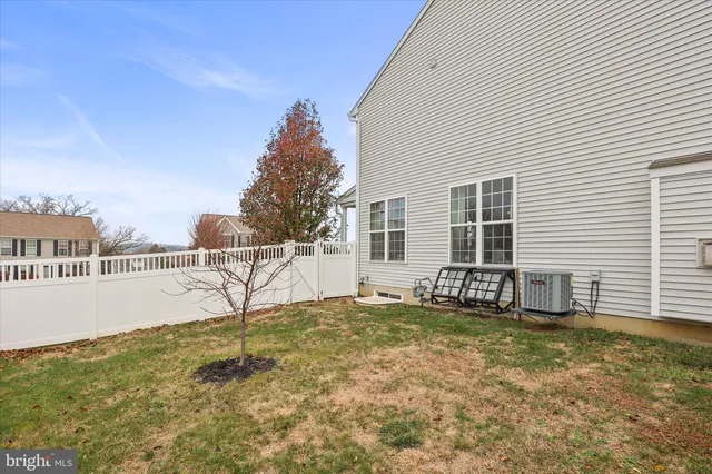 a view of balcony with wooden floor and fence