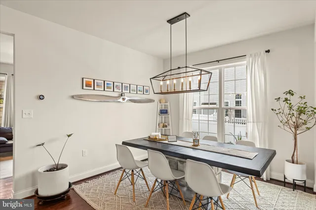 a living room with furniture flat screen tv and a fireplace