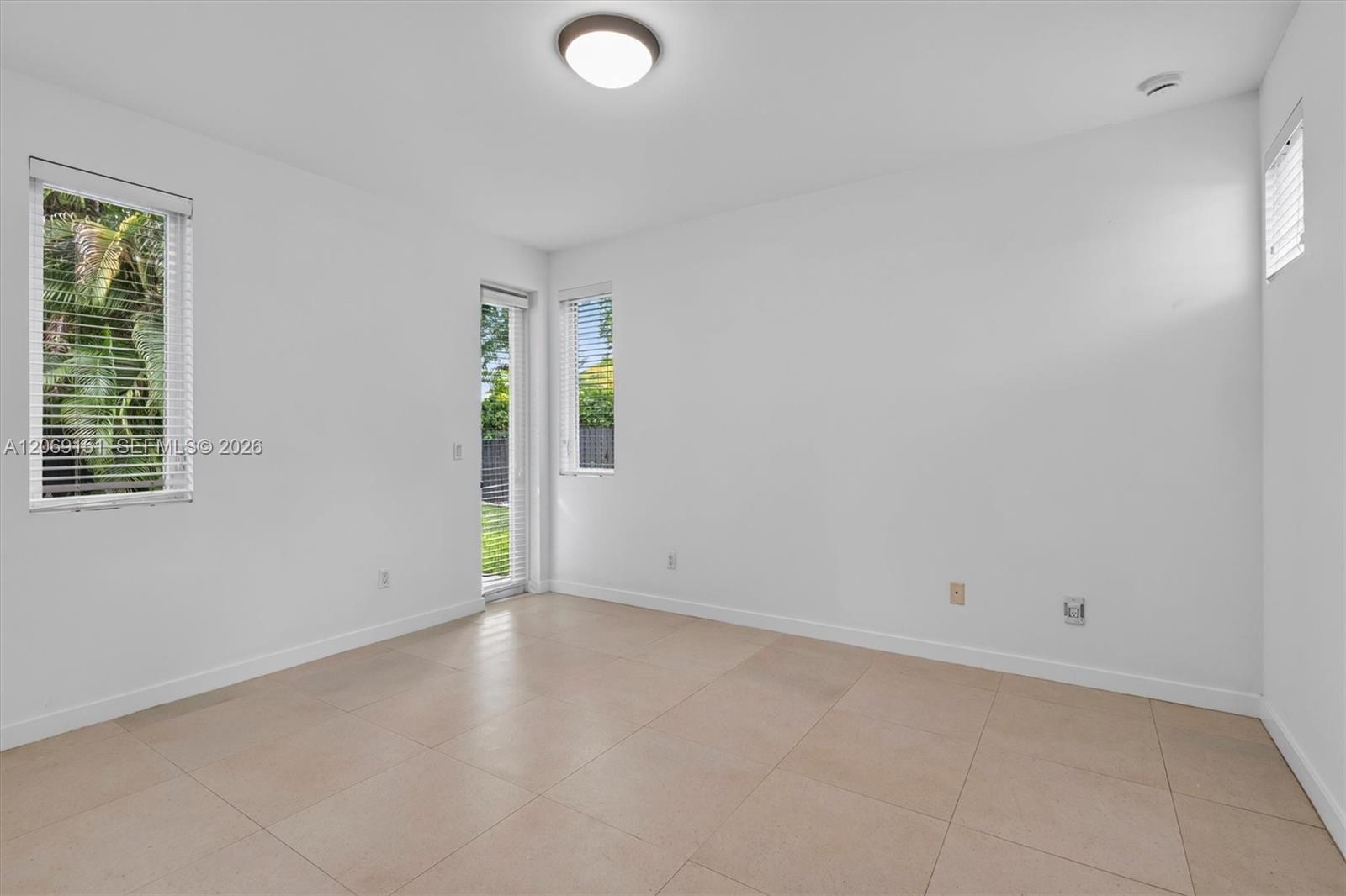 745 Southwest 22nd Road Miami, FL 33129 - Photo 17 of 72 Downstairs Bedroom with door access to Pool/Breezeway