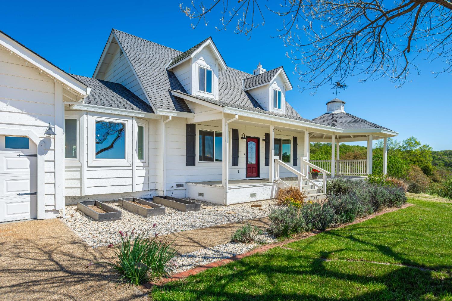10459 Boom Run Road Auburn, CA 95603 - Photo 1 of 1 a front view of a house with garden
