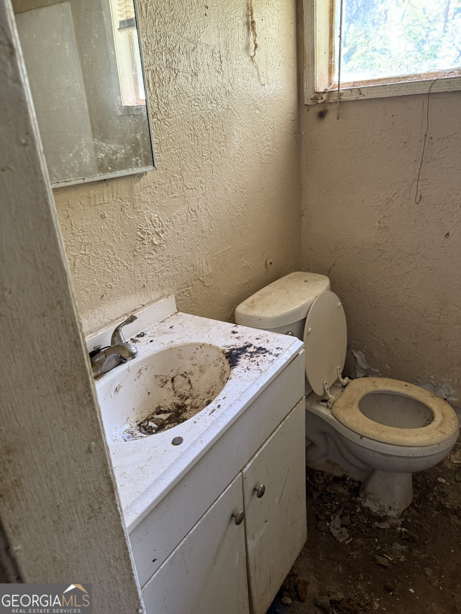 2468 Brevard Drive Macon, GA 31206 - Photo 21 of 27 a bathroom with a sink toilet and window