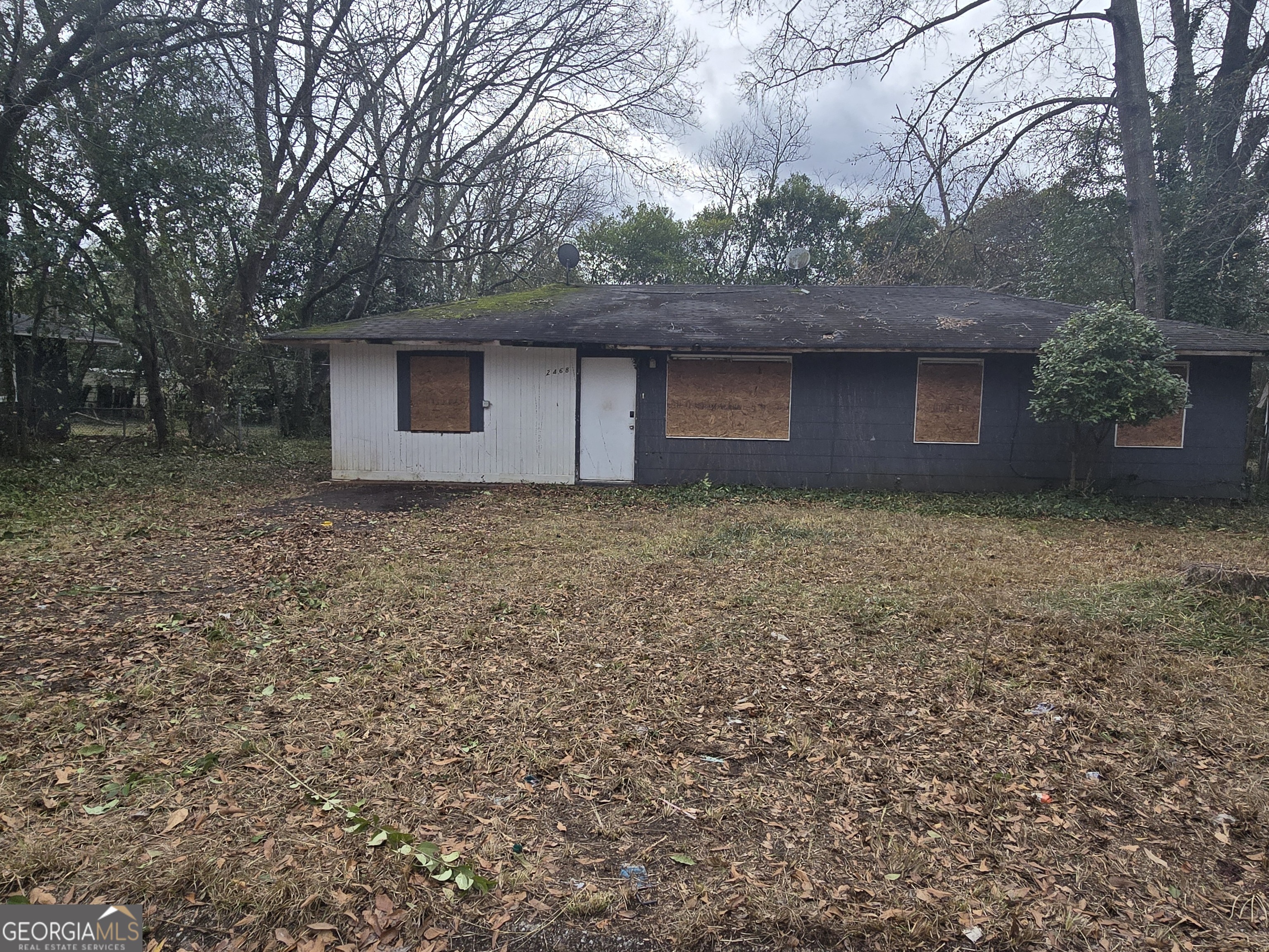 2468 Brevard Drive Macon, GA 31206 - Photo 3 of 27 a front view of a house with large trees