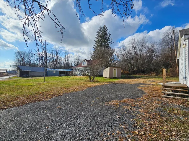 a view of yard with swimming pool