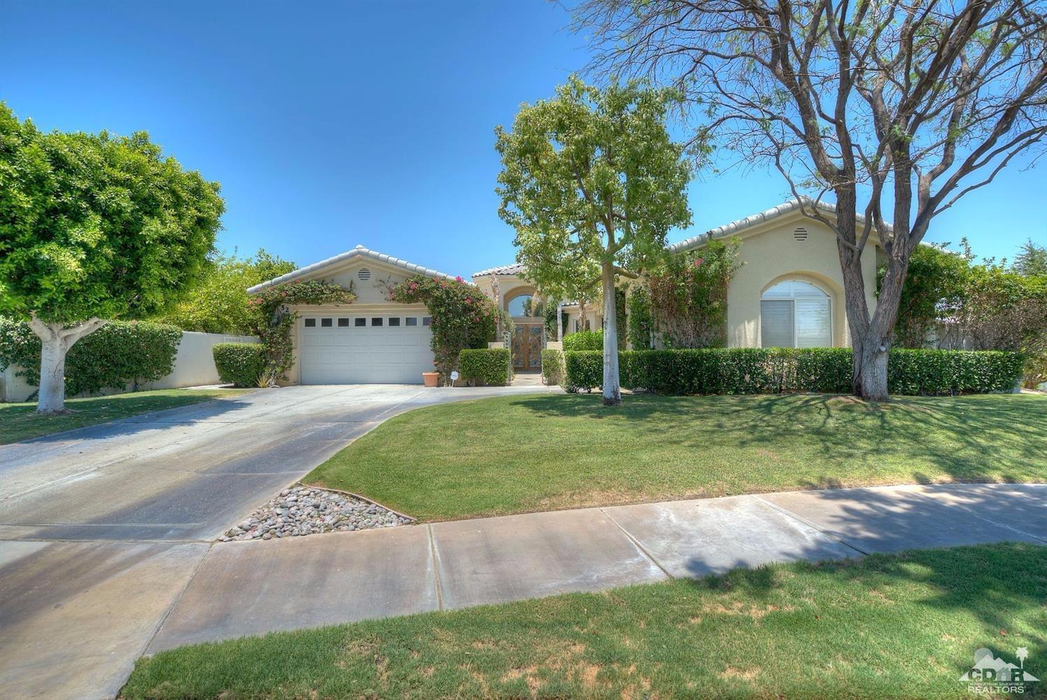 52 Sherwood Road Rancho Mirage, CA 92270 - Photo 1 of 25 a front view of a house with a yard