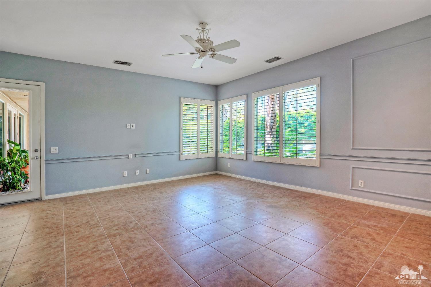 52 Sherwood Road Rancho Mirage, CA 92270 - Photo 14 of 25 a view of an empty room with a window