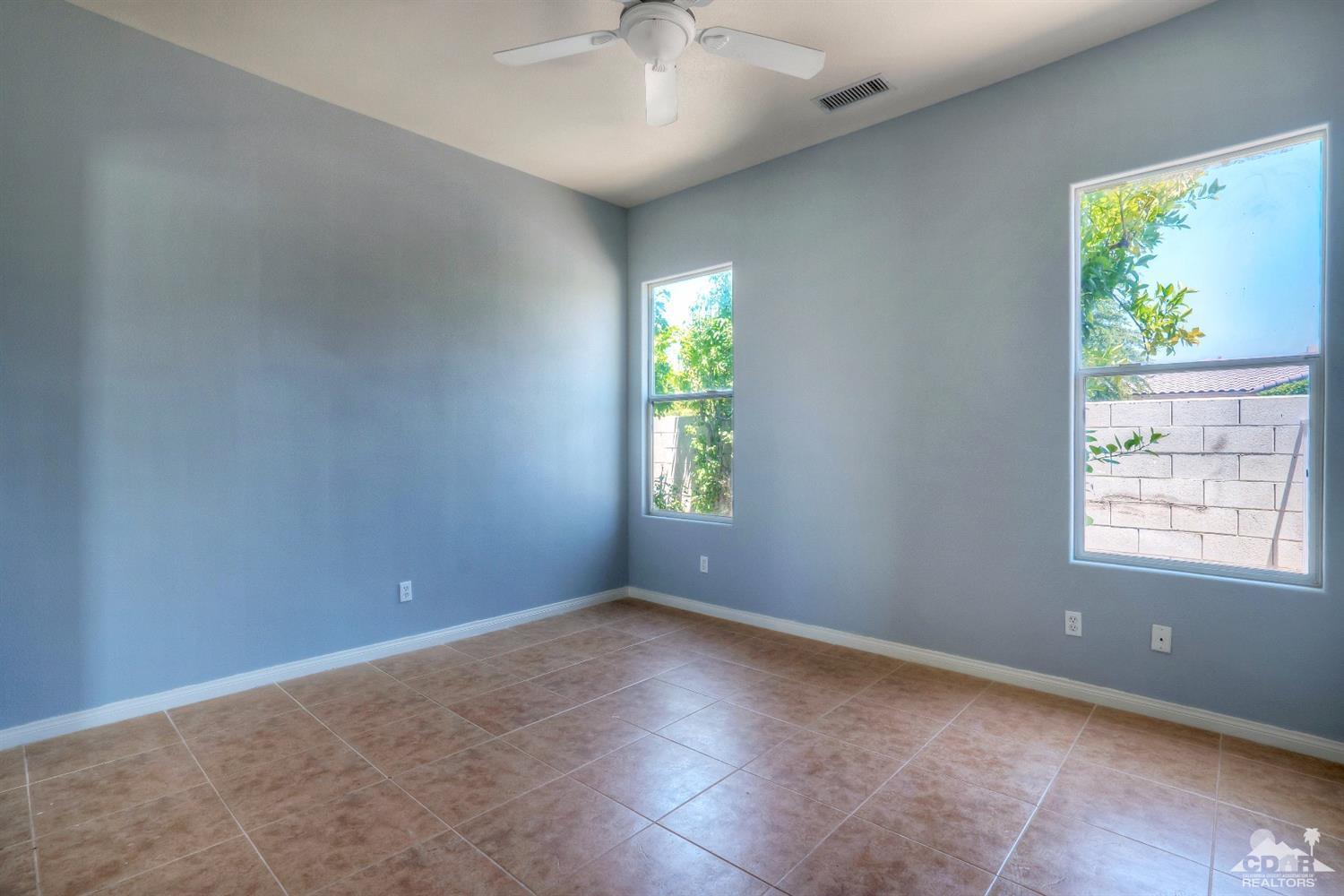 52 Sherwood Road Rancho Mirage, CA 92270 - Photo 17 of 25 an empty room with windows and closet