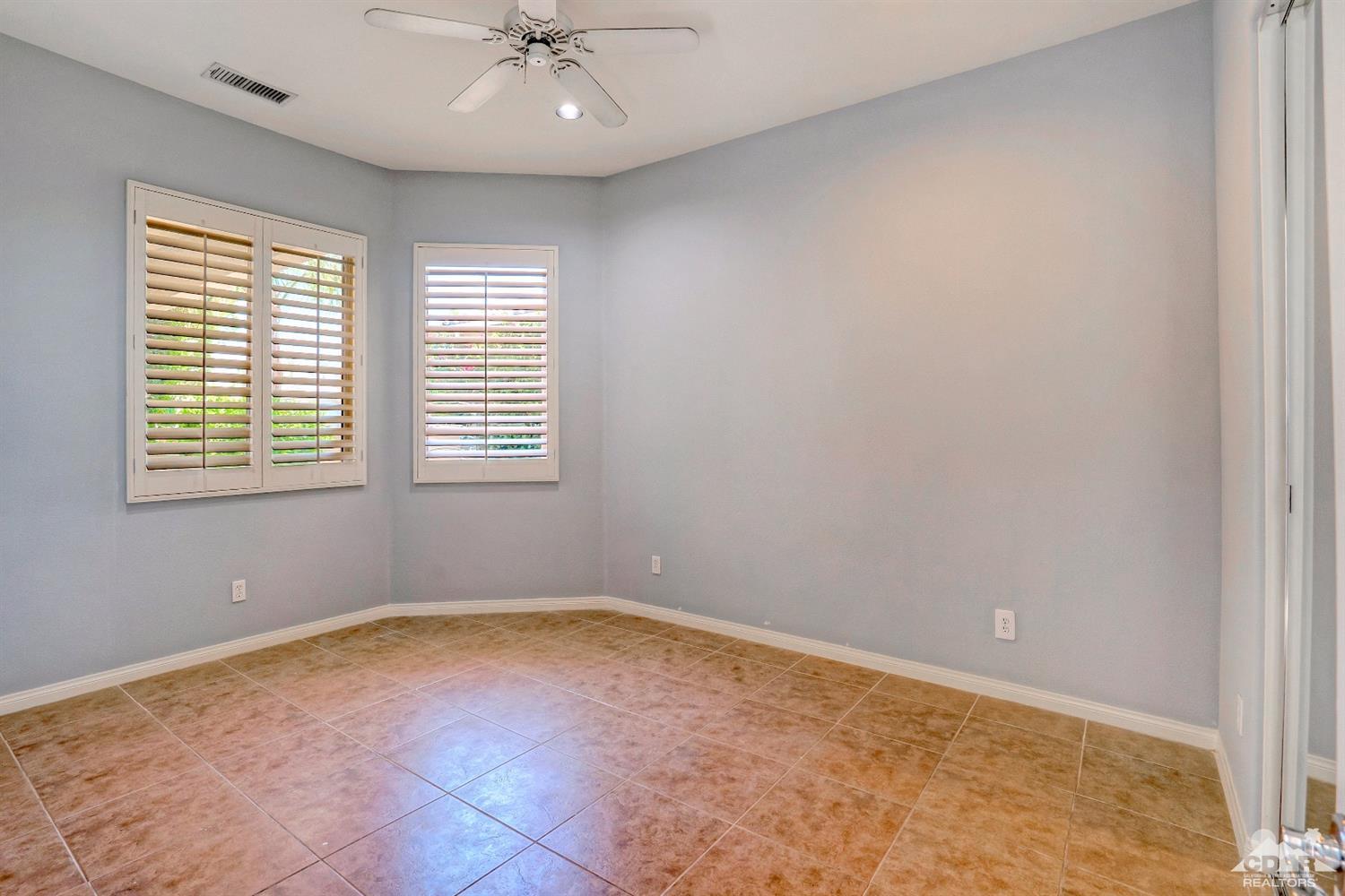 52 Sherwood Road Rancho Mirage, CA 92270 - Photo 19 of 25 a view of an empty room with a window