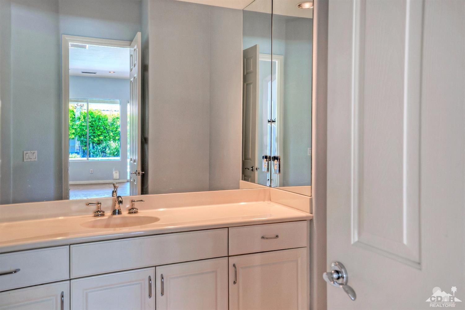 52 Sherwood Road Rancho Mirage, CA 92270 - Photo 20 of 25 a bathroom with a sink and a mirror