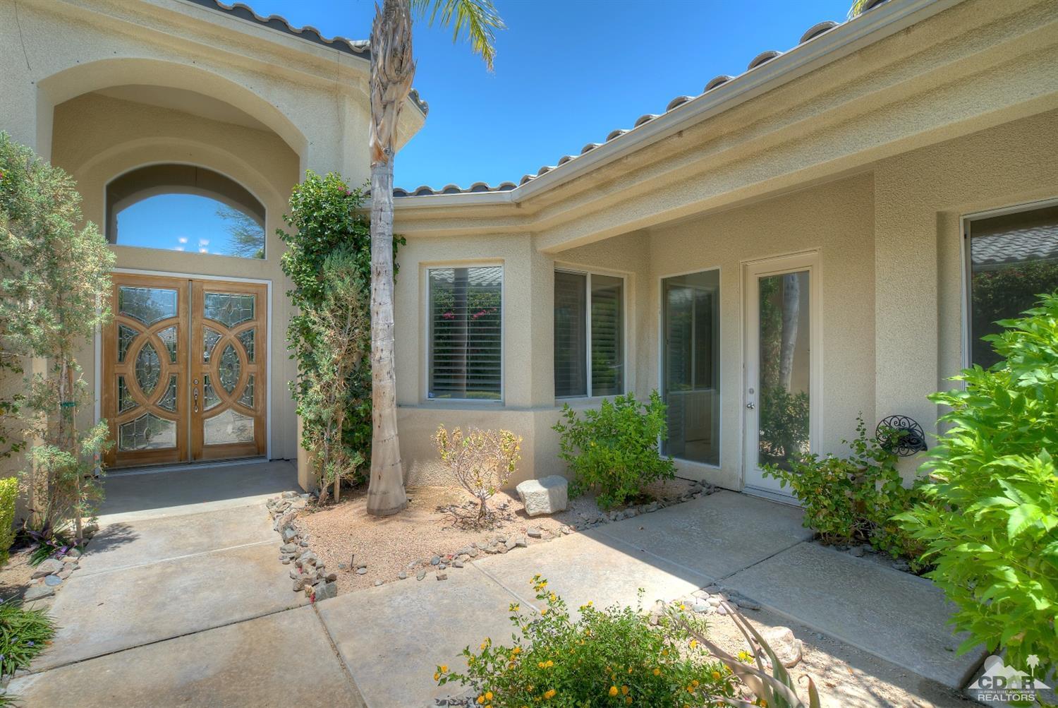 52 Sherwood Road Rancho Mirage, CA 92270 - Photo 2 of 25 a front view of a house with a yard