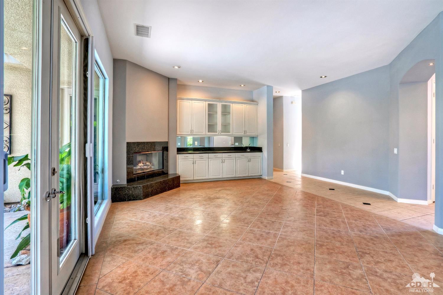 52 Sherwood Road Rancho Mirage, CA 92270 - Photo 5 of 25 a view of an empty room and a kitchen