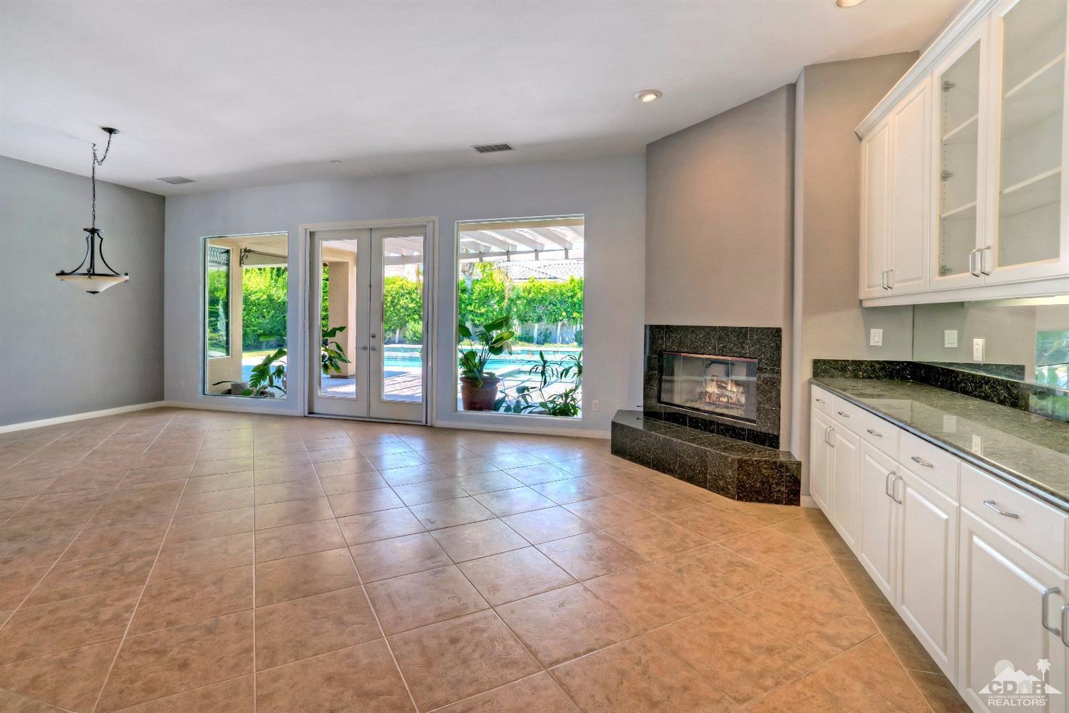 52 Sherwood Road Rancho Mirage, CA 92270 - Photo 6 of 25 a view of an empty room with window and fire place