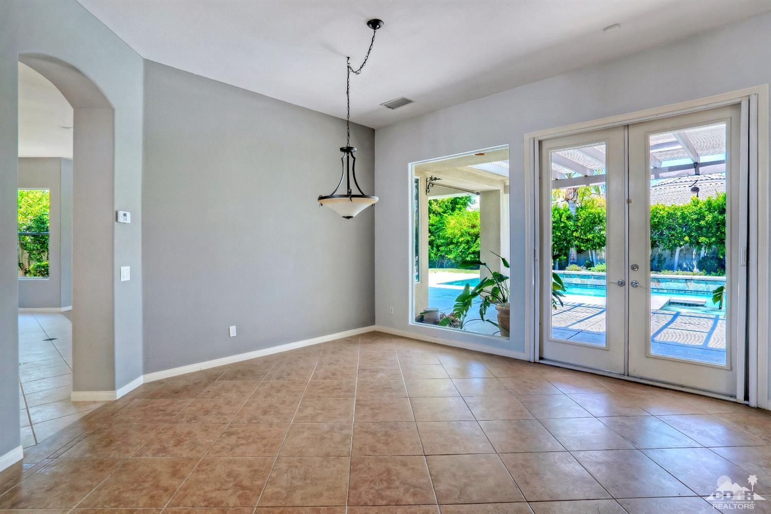 52 Sherwood Road Rancho Mirage, CA 92270 - Photo 7 of 25 a view of an empty room with a sliding door